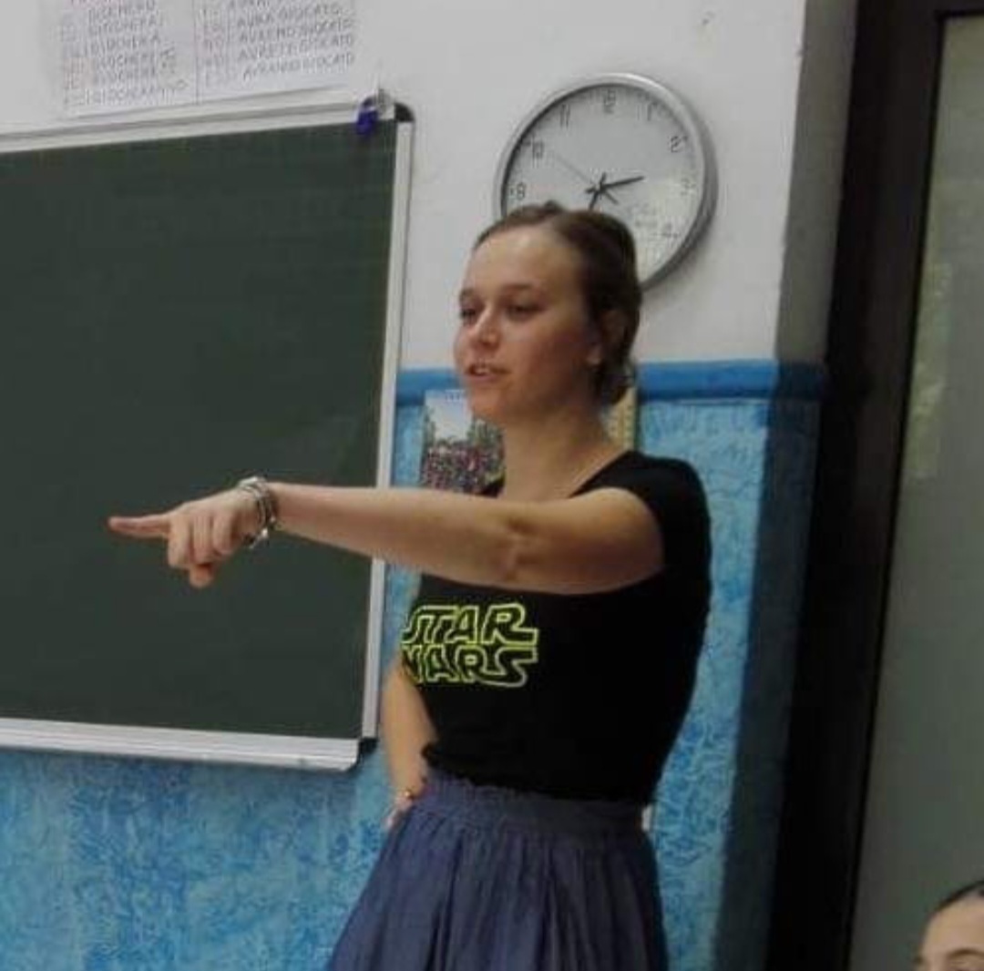 Francesca Luoni enthusiastically presents to school children in a 'Star Wars' T-shirt.