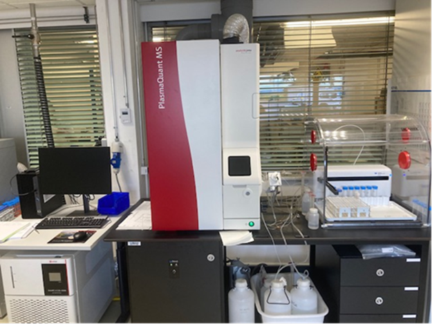 The ICP MS Machine, about 1.4m tall and slick in matte-white with a red trim and a small LCD screen.